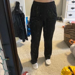 Straight-leg, High-waisted track pants.